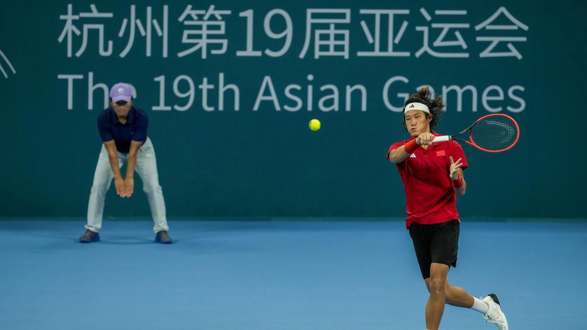 Zhang fights back to win Asian Games tennis gold, beats Watanuki